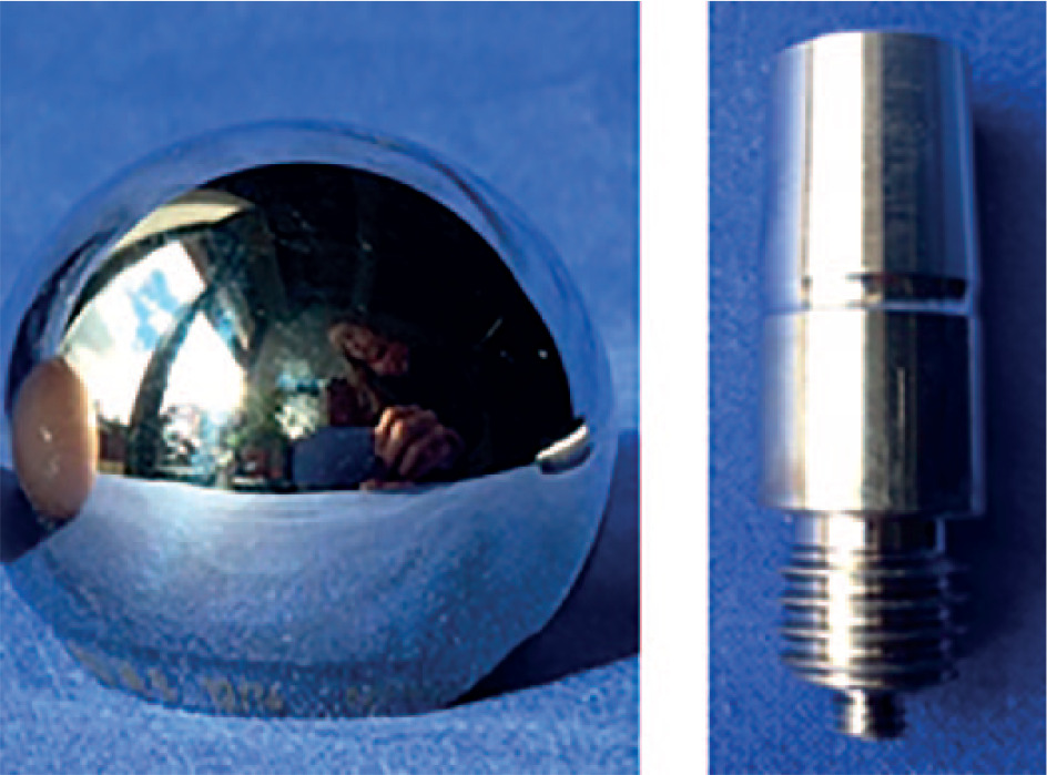 Fig. 1 
          Modular components: left) Ø 32 mm cobalt-chrome femoral head; right) 12/14 replica titanium alloy stem taper. The threaded distal end of the replica stem taper was necessary for anchorage to the base plate.
        