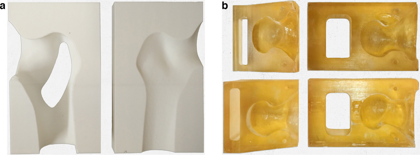 Fig. 2 
            a) 3D-printed nailing target of the cephalomedullary nail. b) 3D-printed osteotomy guide of AO/OTA type 31-A2.3 intertrochanteric fracture.
          