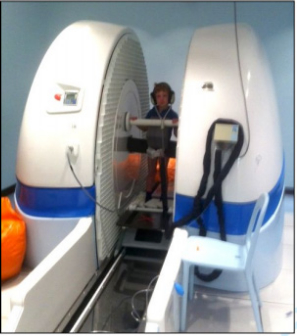 Fig. 1 
          Standing position for a child during the 2.5 minute weightbearing MRI scan. Foam blocks are used to hold the child in comfortable resting position.
        